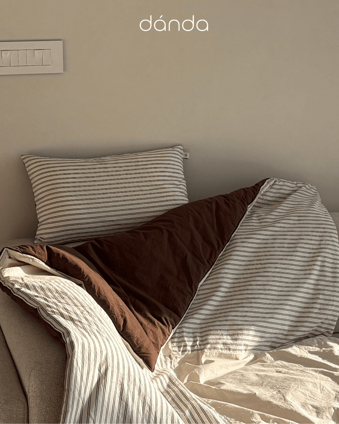 Minimalist scene with striped bedding